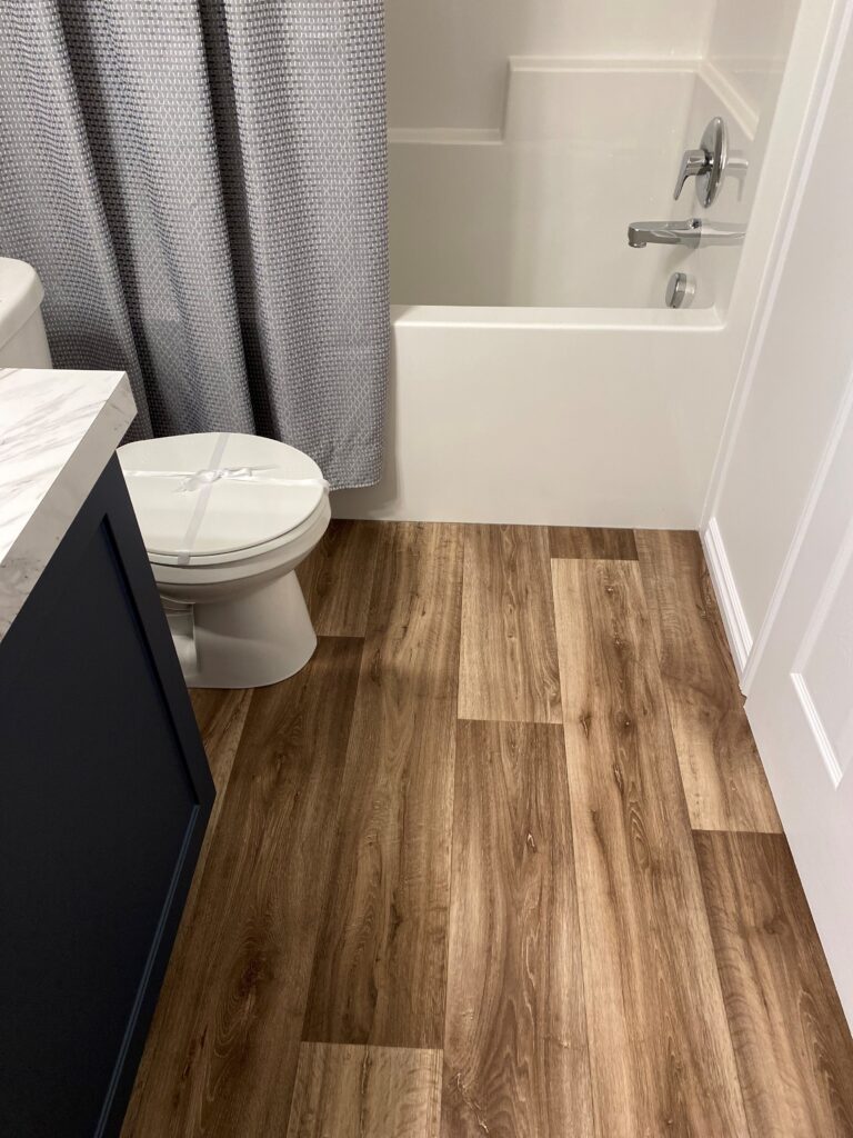 LVP flooring installation in bathroom in Edmonton