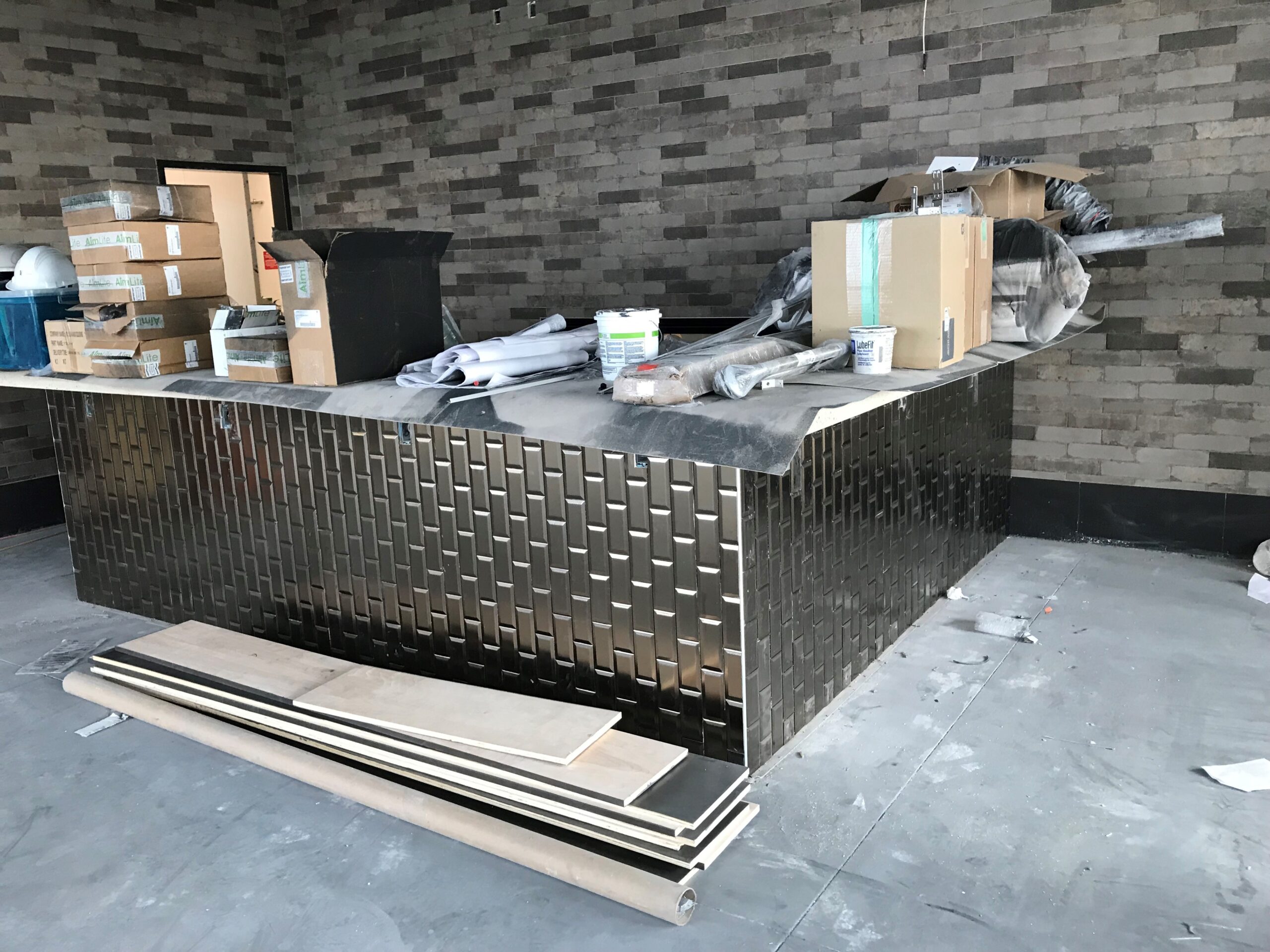 Custom bar tile installation during commercial renovation in Edmonton