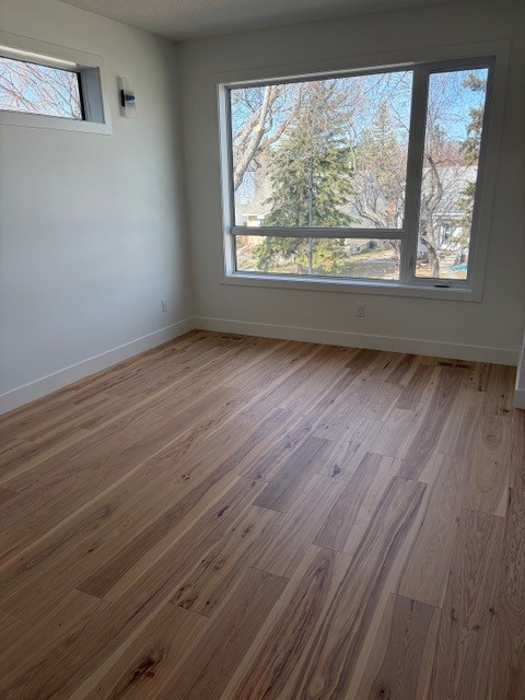 Bedroom hardwood flooring installation in Edmonton