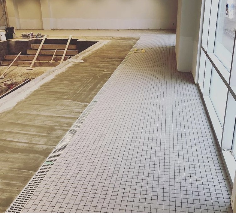 Swimming pool surface preparation for new tiles in Edmonton