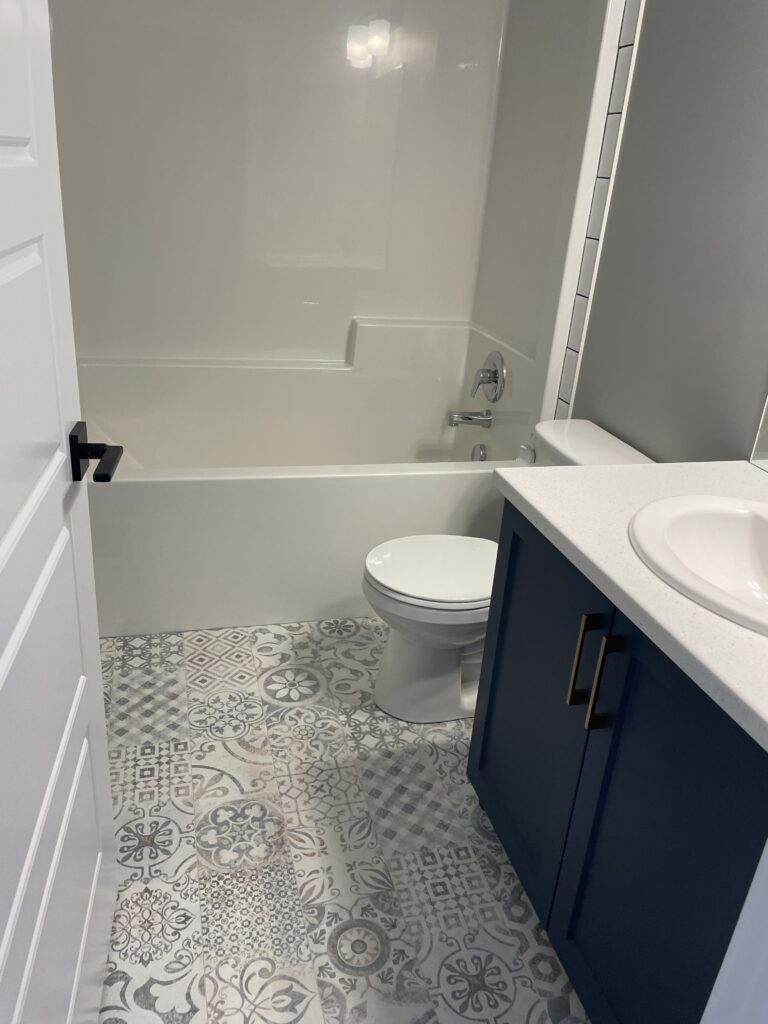 Modern bathroom renovation with tile flooring in Edmonton