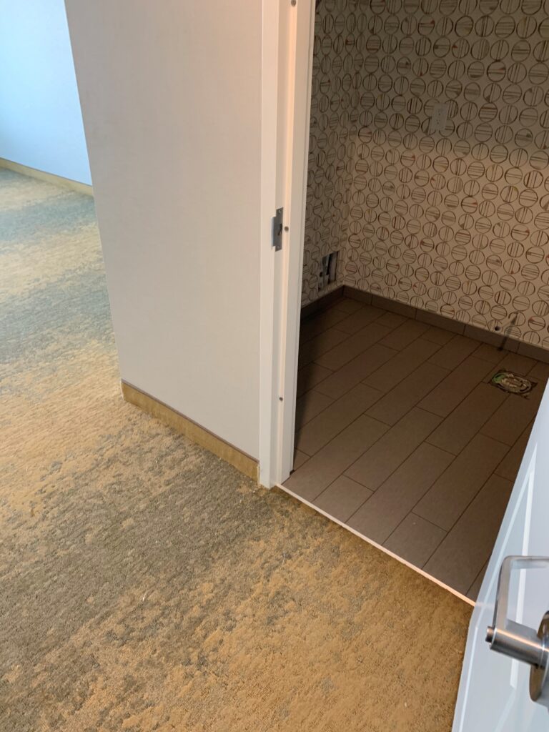 Hotel room tile and carpet flooring installation in Edmonton